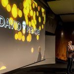 David on stage | Behavioural Science Keynote speaker hosting | David Meade